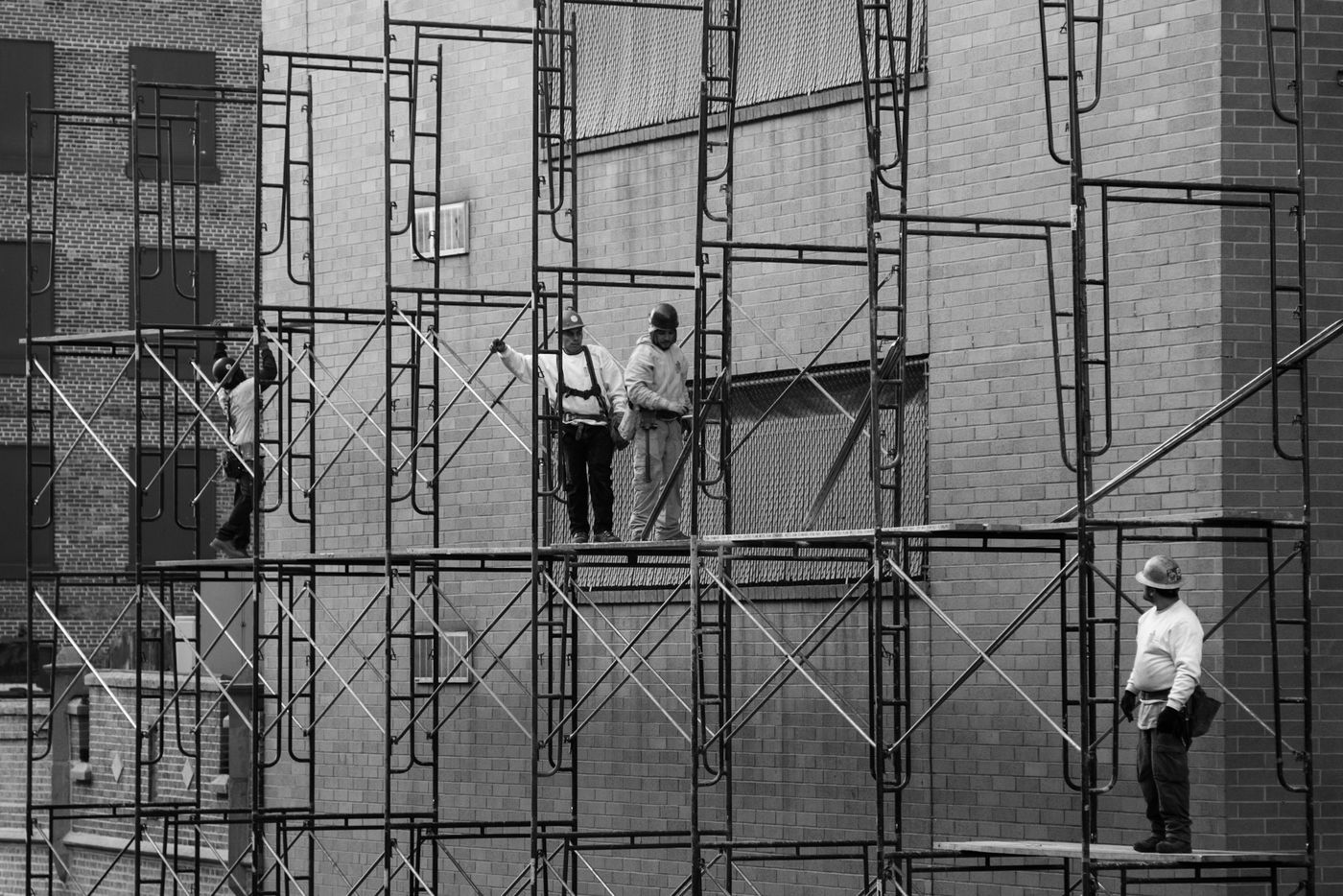 Construction crew working on building scaffolding in New York City